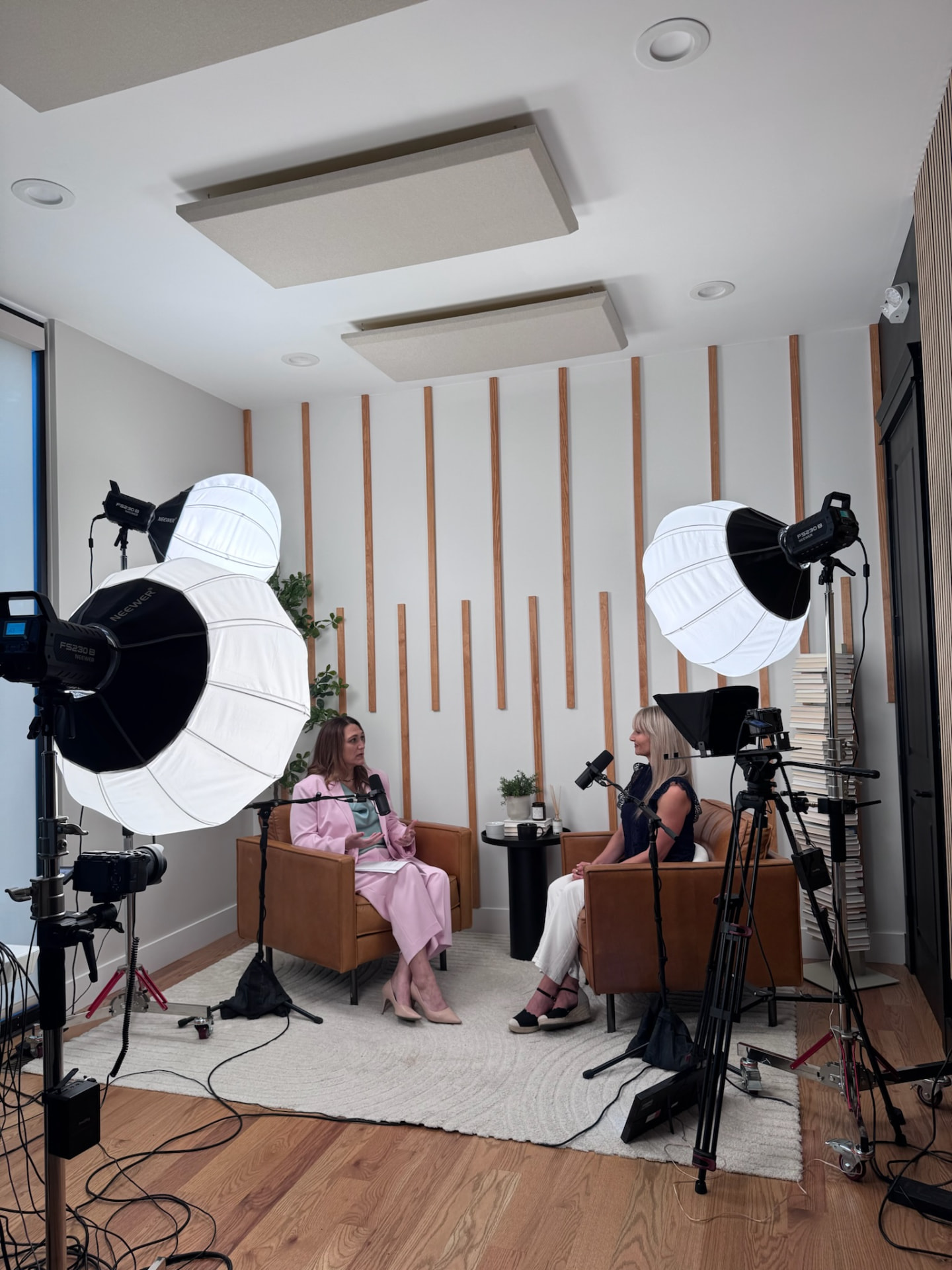 Joy St. John recording an interview on a podcast set